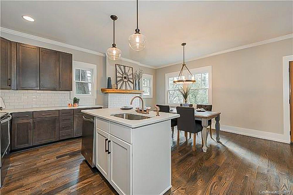2116 Rozzelles Ferry Road Charlotte, NC 28208 - Photo 14 of 24 a kitchen with sink stove and cabinets