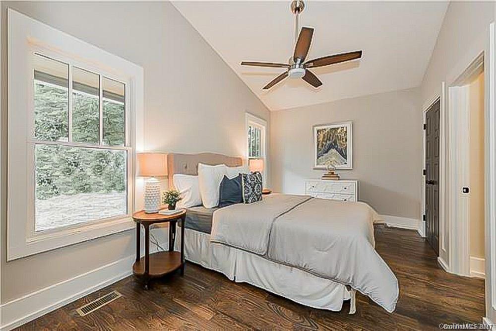 2116 Rozzelles Ferry Road Charlotte, NC 28208 - Photo 17 of 24 a bedroom with a bed wooden floor and window