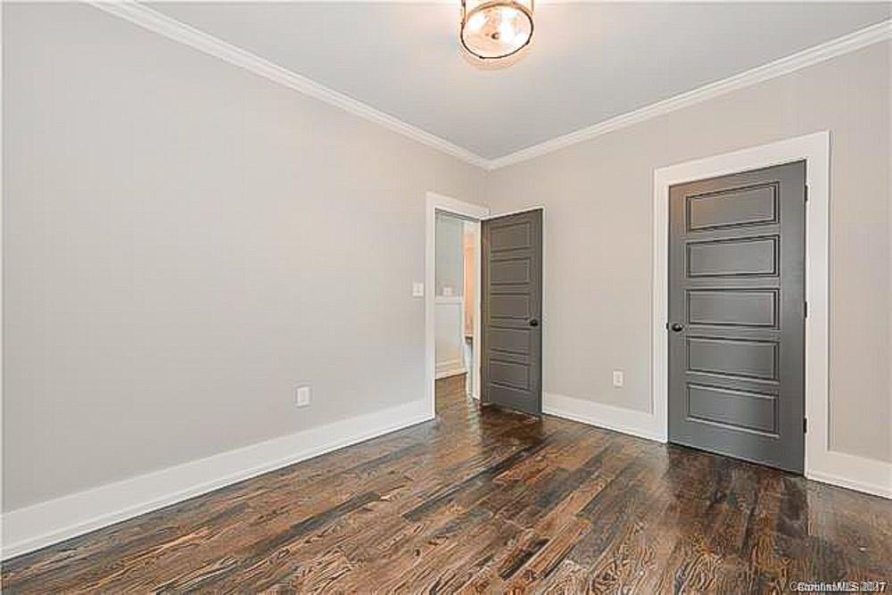 2116 Rozzelles Ferry Road Charlotte, NC 28208 - Photo 21 of 24 a view of empty room with wooden floor