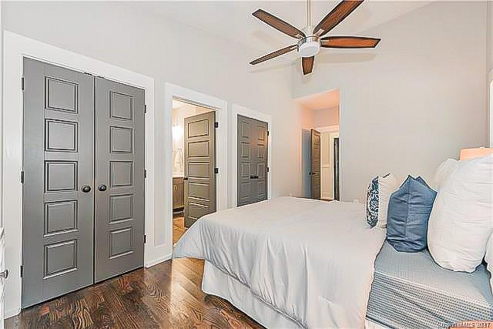 2116 Rozzelles Ferry Road Charlotte, NC 28208 - Photo 22 of 24 a bedroom with a large bed and ceiling fan