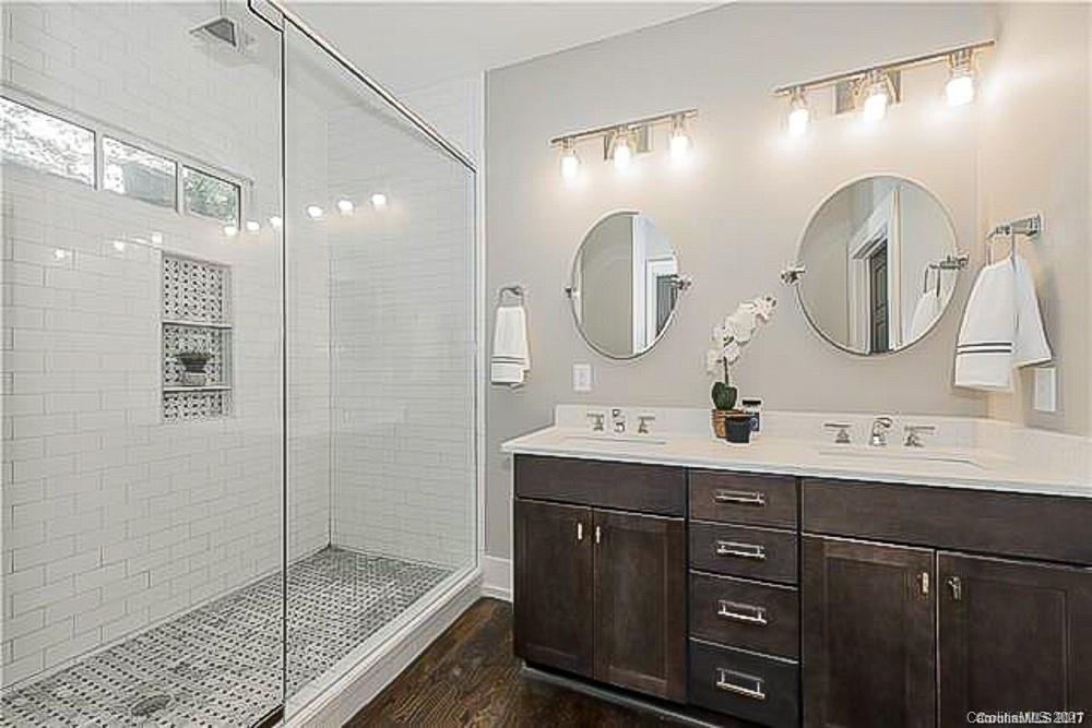 2116 Rozzelles Ferry Road Charlotte, NC 28208 - Photo 23 of 24 a bathroom with a double vanity sink mirror and shower