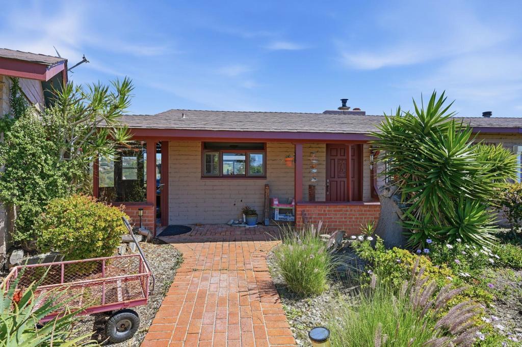 1355 Rainbow Ridge Lane Encinitas, CA 92024 - Photo 15 of 45 a front view of a house with garden