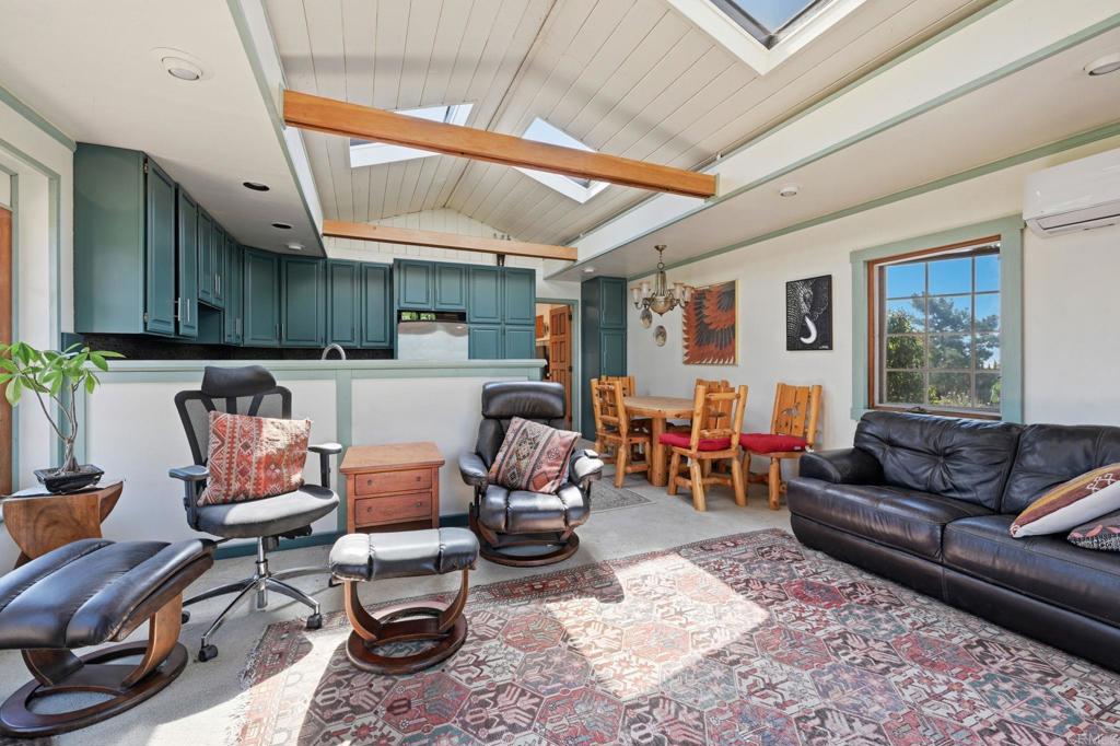1355 Rainbow Ridge Lane Encinitas, CA 92024 - Photo 18 of 45 a living room with furniture and a large window