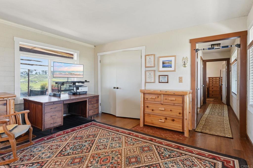 1355 Rainbow Ridge Lane Encinitas, CA 92024 - Photo 25 of 45 a room with furniture and a dresser