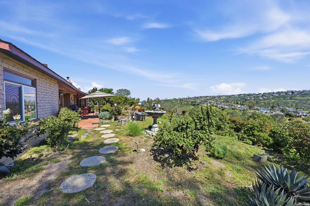 1355 Rainbow Ridge Lane Encinitas, CA 92024 - Photo 30 of 45 a view of a houses with a yard