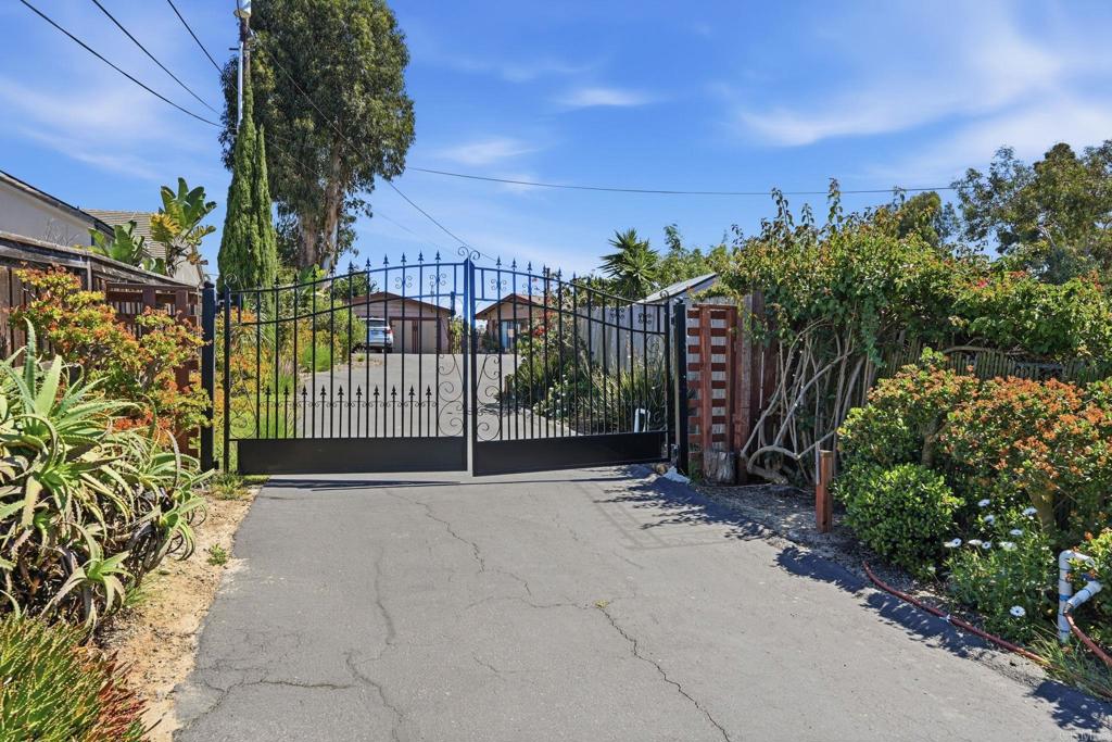 1355 Rainbow Ridge Lane Encinitas, CA 92024 - Photo 6 of 45 a view of a garden with a building in the background