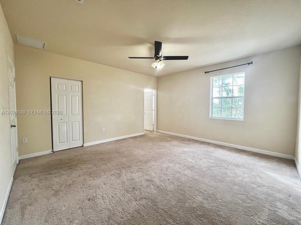17001 Southwest 96th Street Miami, FL 33196 - Photo 15 of 23 a view of an empty room with a window