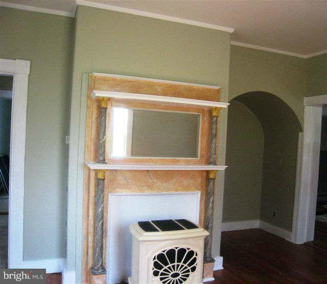 213 Jones Road Chester, MD 21619 - Photo 12 of 27 Wood stove with faux finish insert