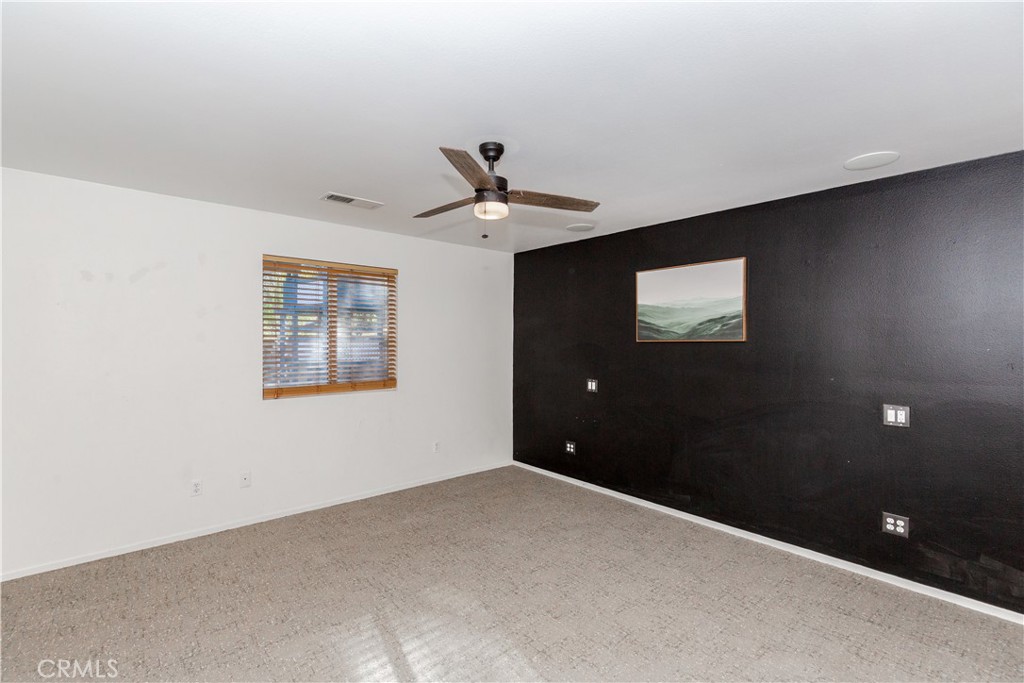 1457 Faircliff Street Beaumont, CA 92223 - Photo 11 of 37 a view of an empty room with a ceiling fan