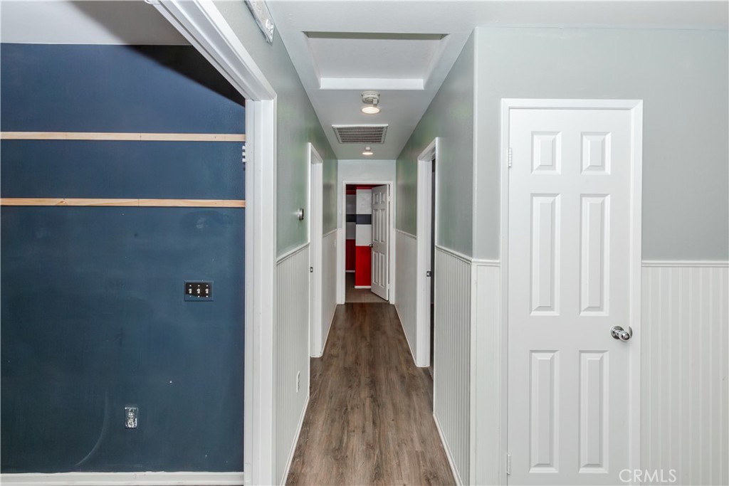 1457 Faircliff Street Beaumont, CA 92223 - Photo 19 of 37 a view of a hallway with wooden floor and closet
