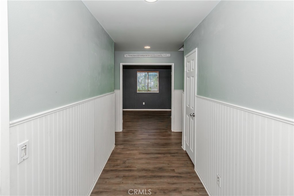 1457 Faircliff Street Beaumont, CA 92223 - Photo 20 of 37 a view of a hallway with wooden floor and entryway
