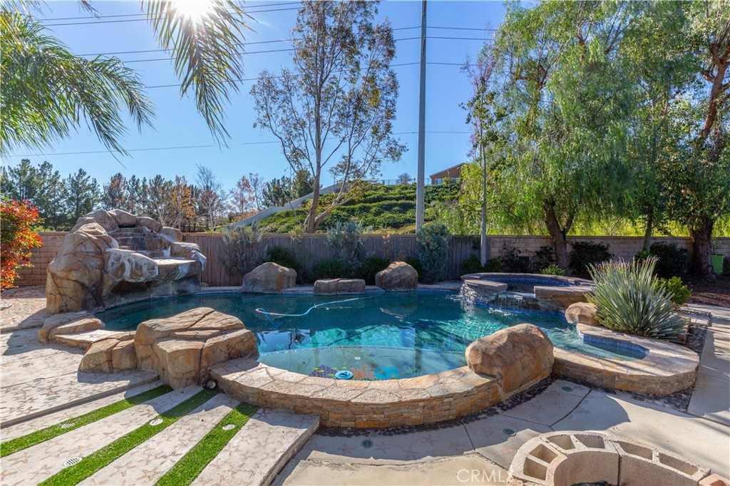 1457 Faircliff Street Beaumont, CA 92223 - Photo 24 of 37 a view of a patio with couches table and chairs and potted plants
