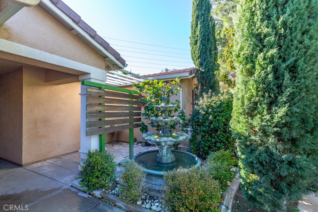 1457 Faircliff Street Beaumont, CA 92223 - Photo 3 of 37 a view of a chair and table in backyard of the house