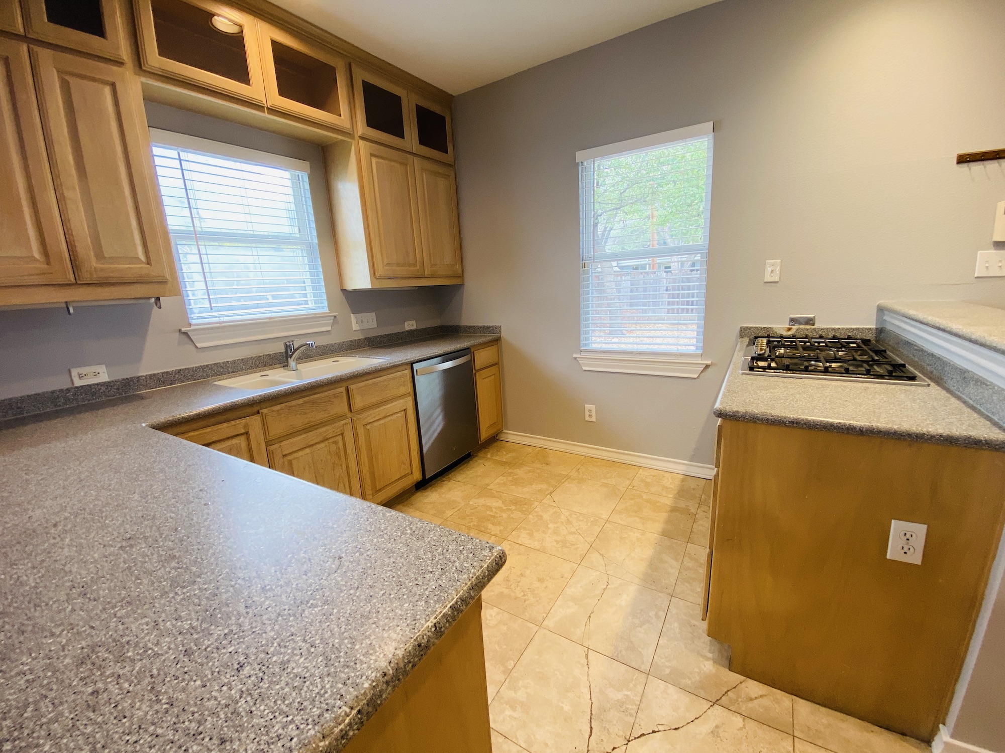 404 East 35th Street, Unit A Austin, TX 78705 - Photo 12 of 36 a kitchen with sink a window and cabinets