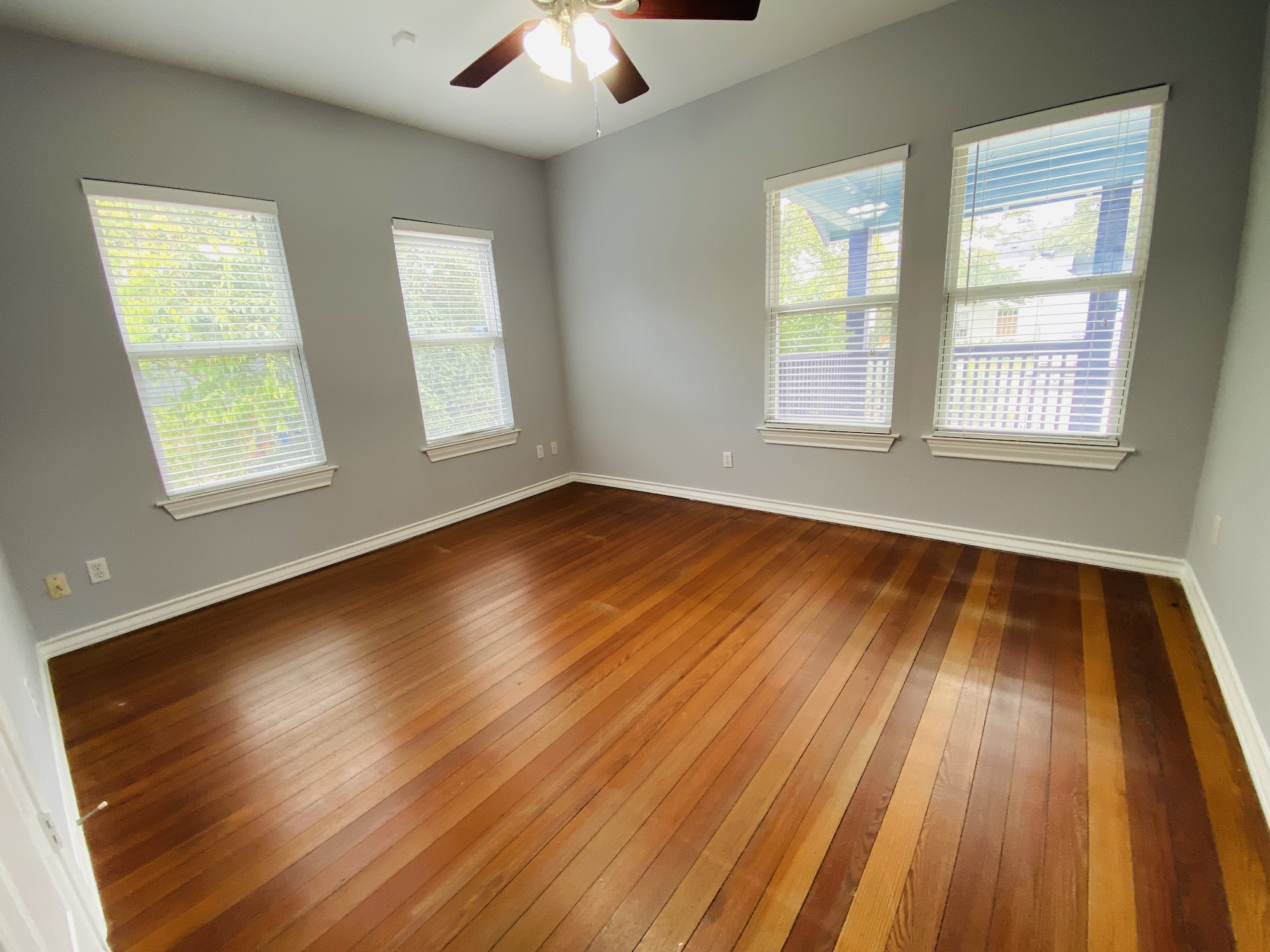 404 East 35th Street, Unit A Austin, TX 78705 - Photo 18 of 36 a view of an empty room with wooden floor and a window