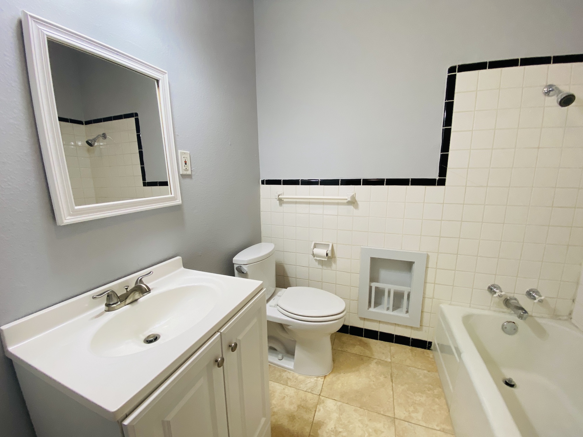 404 East 35th Street, Unit A Austin, TX 78705 - Photo 20 of 36 a bathroom with a sink mirror and toilet