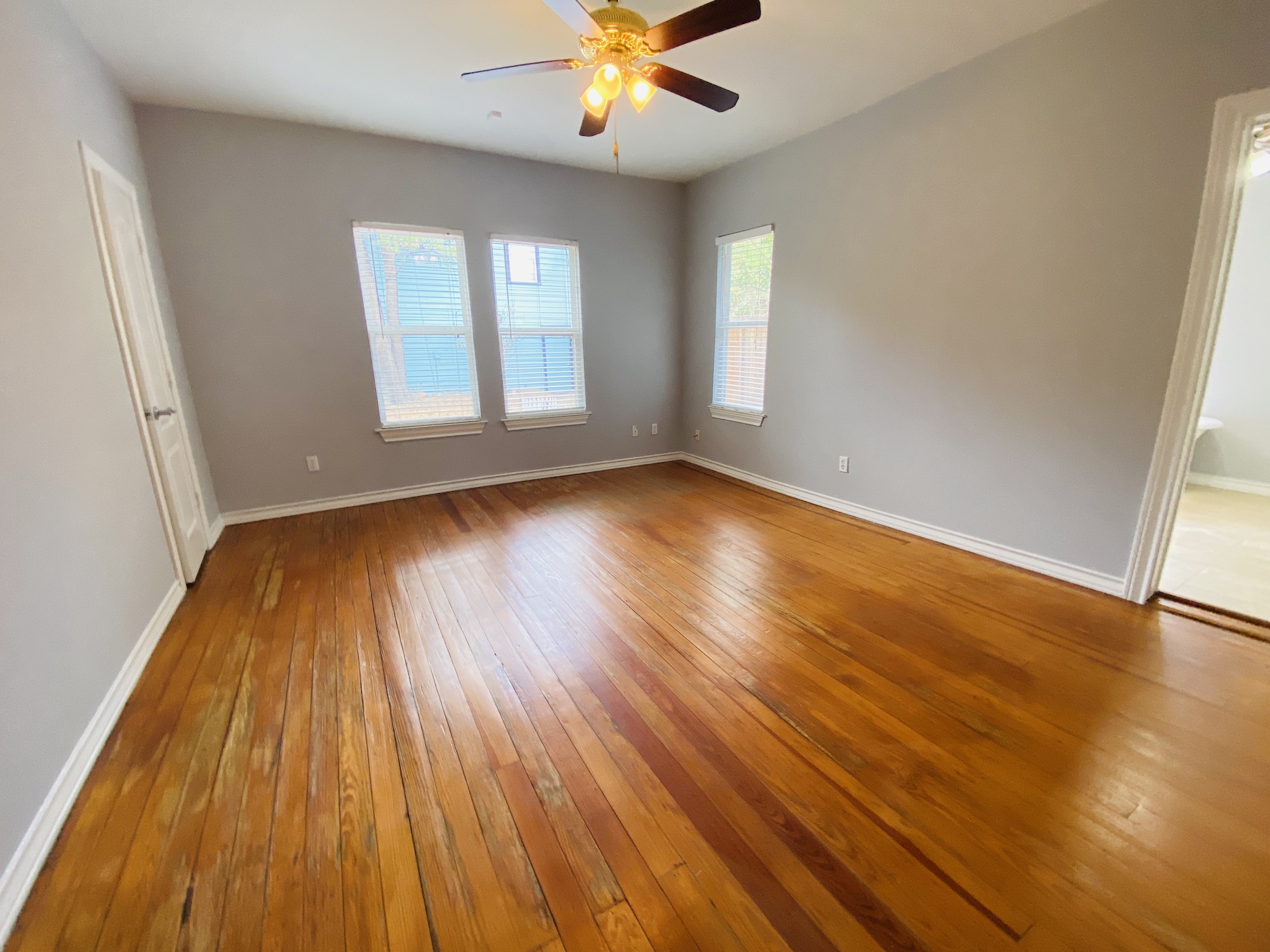 404 East 35th Street, Unit A Austin, TX 78705 - Photo 25 of 36 wooden floor in an empty room with a window