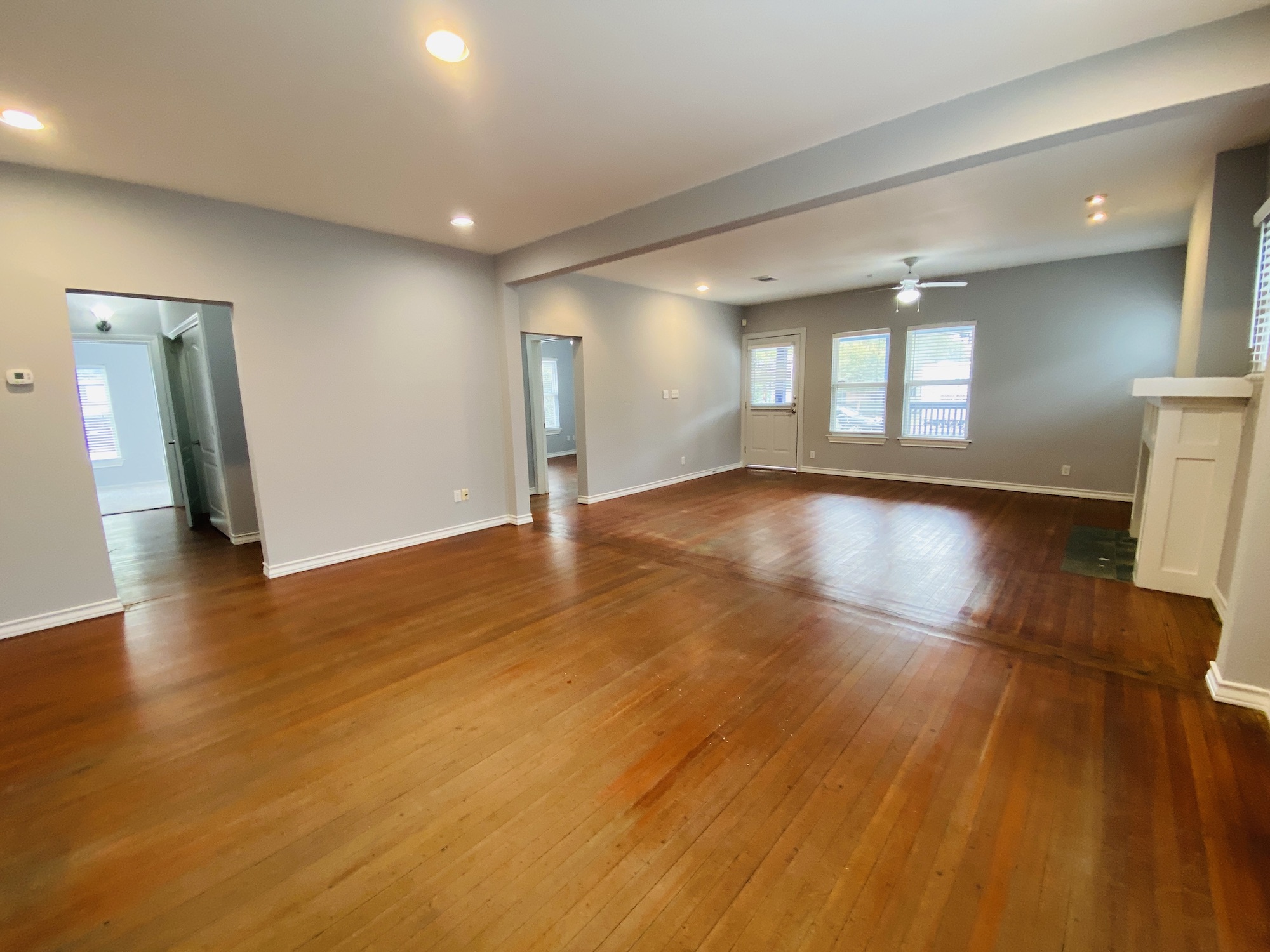404 East 35th Street, Unit A Austin, TX 78705 - Photo 7 of 36 a view of an empty room with wooden floor and a window