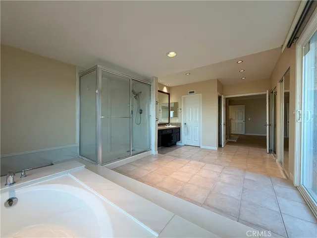 a bathroom with a sink and shower