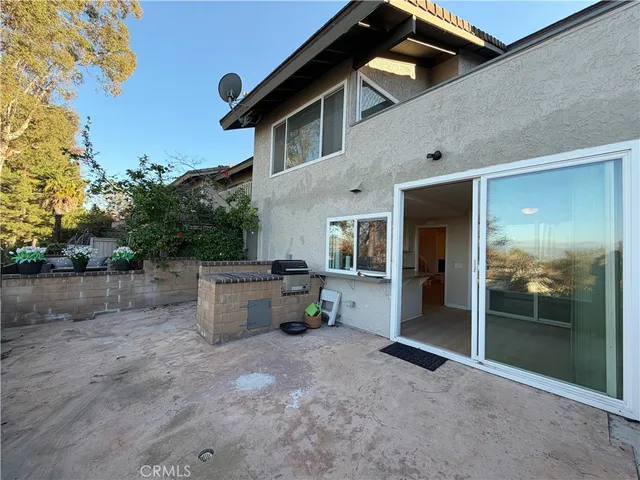a view of a terrace with outdoor seating and lake view