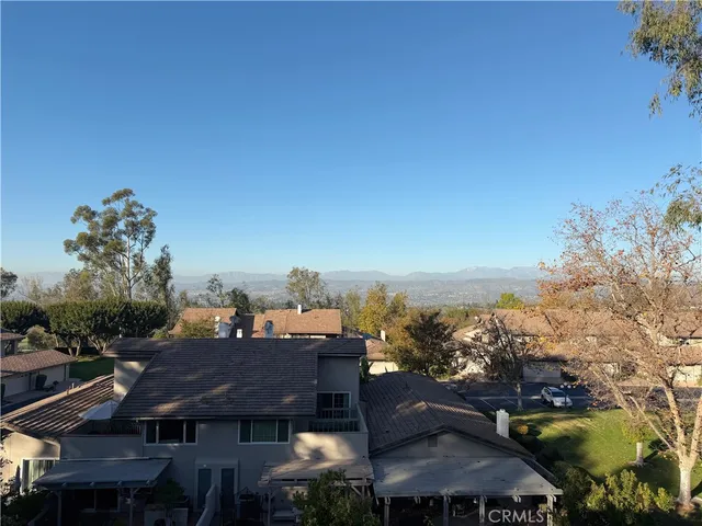 a view of a terrace with a garden and mountain view