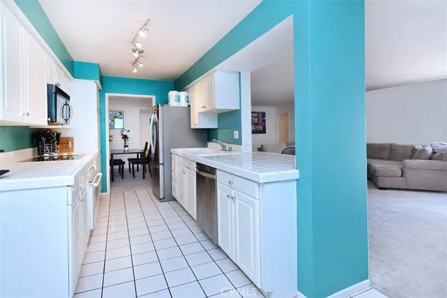 a view of a workspace with furniture