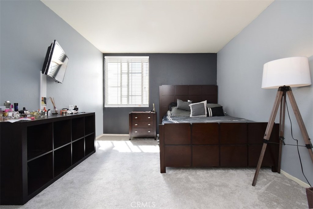 5050 Coldwater Canyon Avenue, Unit 306 Sherman Oaks, CA 91423 - Photo 18 of 24 a bed room with a bed and a window