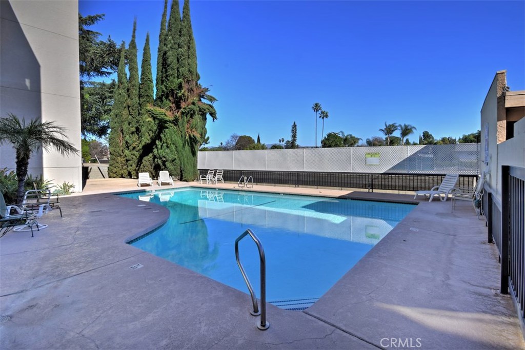 5050 Coldwater Canyon Avenue, Unit 306 Sherman Oaks, CA 91423 - Photo 24 of 24 a view of a swimming pool with a lounge chairs