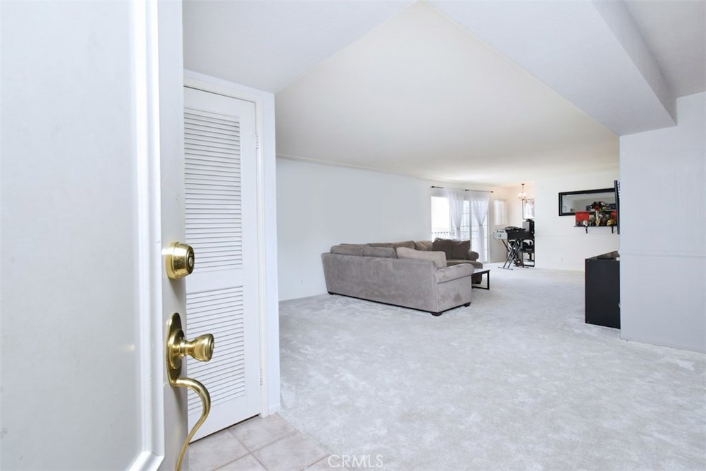5050 Coldwater Canyon Avenue, Unit 306 Sherman Oaks, CA 91423 - Photo 4 of 24 a living room with furniture and a wall painting