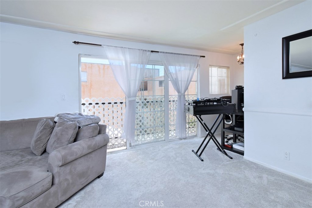 5050 Coldwater Canyon Avenue, Unit 306 Sherman Oaks, CA 91423 - Photo 9 of 24 a living room with furniture and a wooden floor