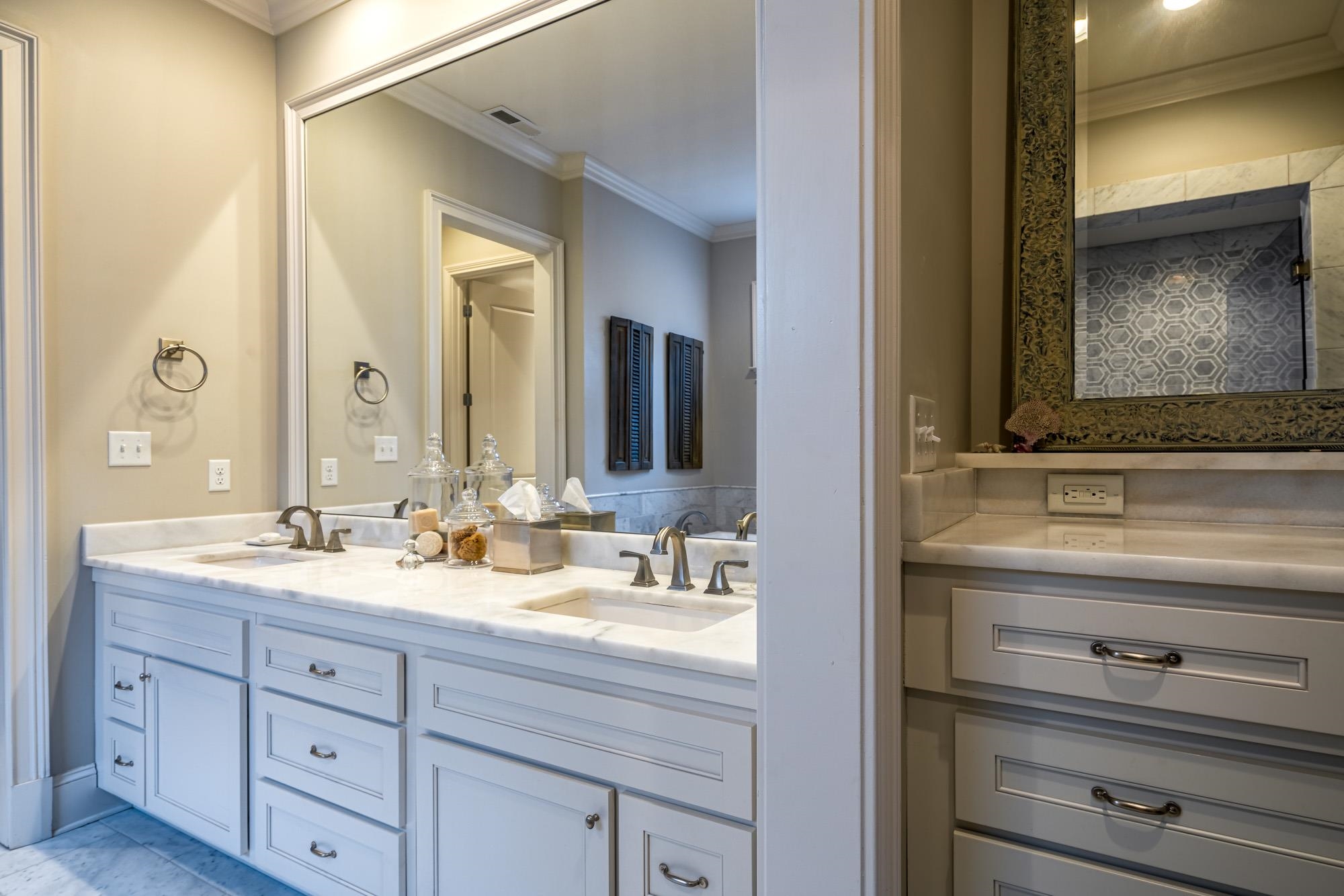 275 Barry Road Memphis, TN 38117 - Photo 19 of 25 a bathroom with a double vanity sink and a mirror