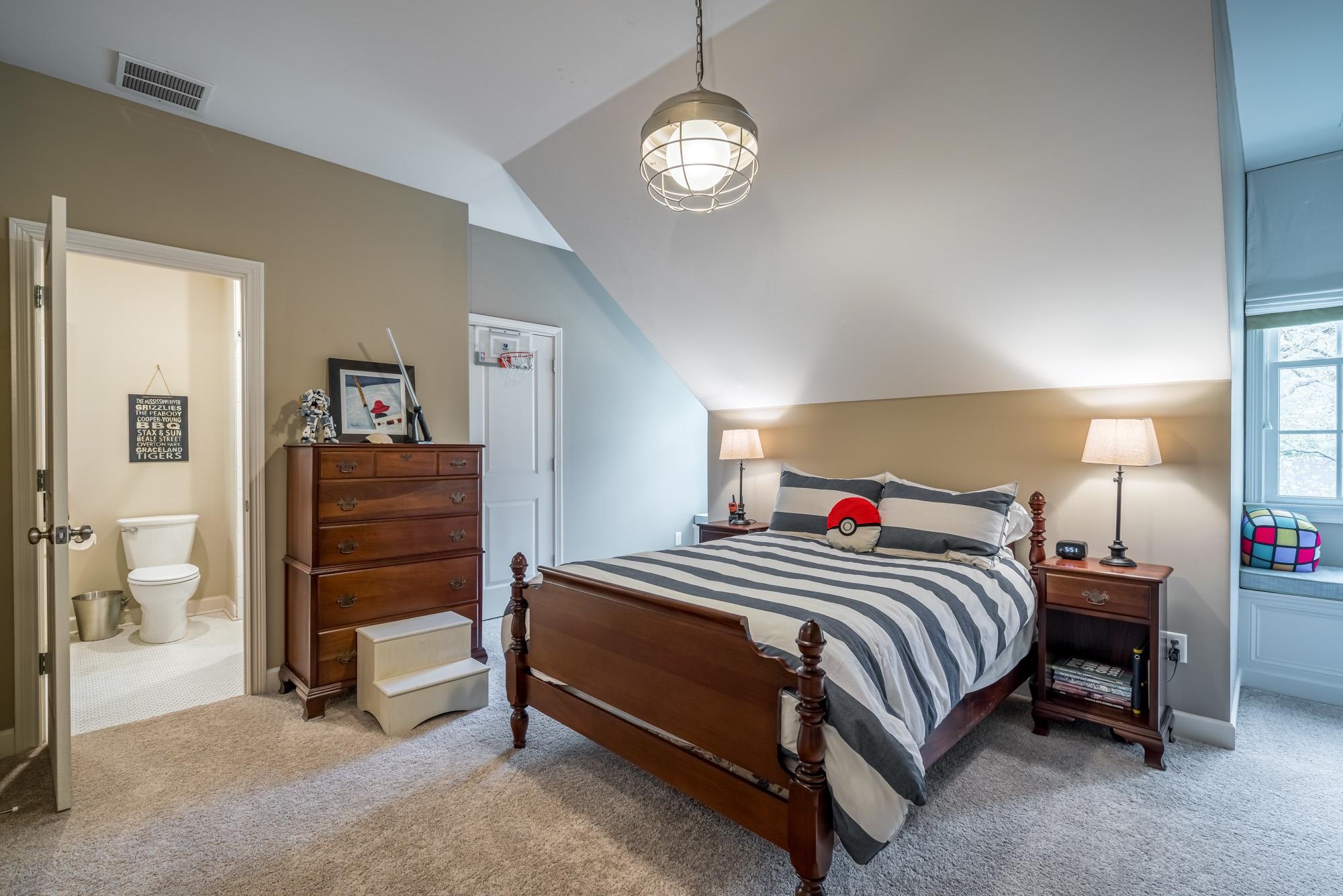 275 Barry Road Memphis, TN 38117 - Photo 20 of 25 a bedroom with a bed and a chandelier
