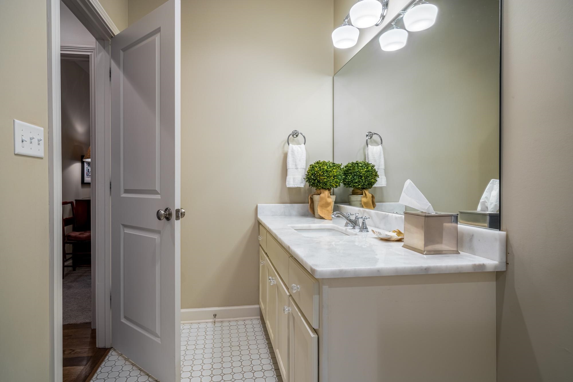 275 Barry Road Memphis, TN 38117 - Photo 21 of 25 a bathroom with a sink and a mirror
