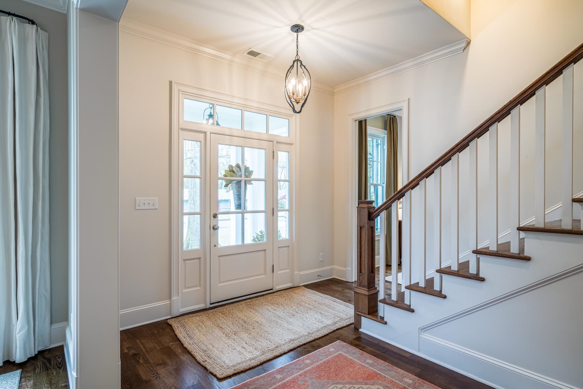 275 Barry Road Memphis, TN 38117 - Photo 3 of 25 a view of an entryway with wooden floor and stairs