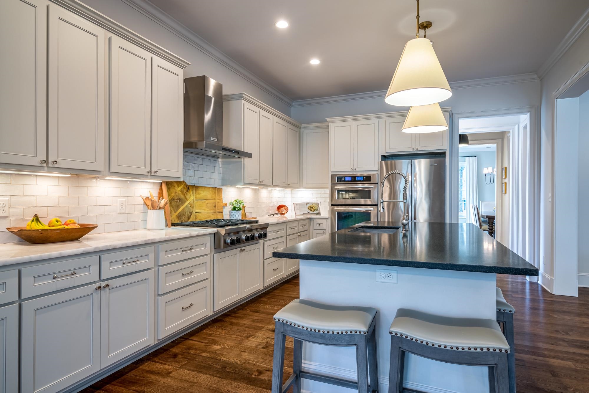 275 Barry Road Memphis, TN 38117 - Photo 8 of 25 a kitchen with stainless steel appliances granite countertop a sink refrigerator and cabinets