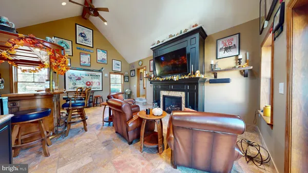 a bedroom with furniture and a flat screen tv