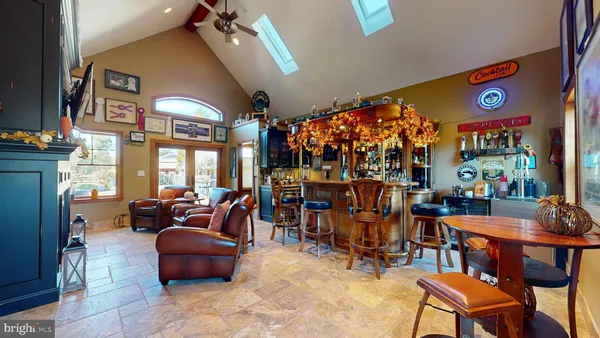 a dining room with furniture and wooden floor