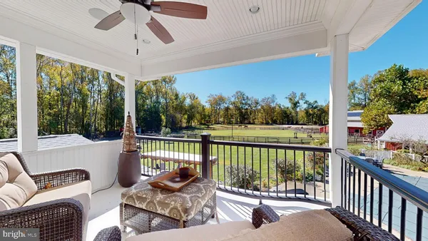 a kitchen with stainless steel appliances granite countertop a table and chairs in it