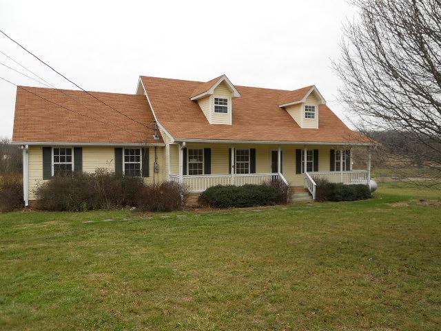 958 Rocky Valley Road Lebanon, TN 37090 - Photo 1 of 20 a front view of a house with a garden