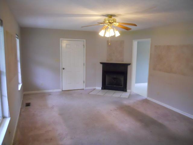 958 Rocky Valley Road Lebanon, TN 37090 - Photo 2 of 20 a view of an empty room with a chandelier fan