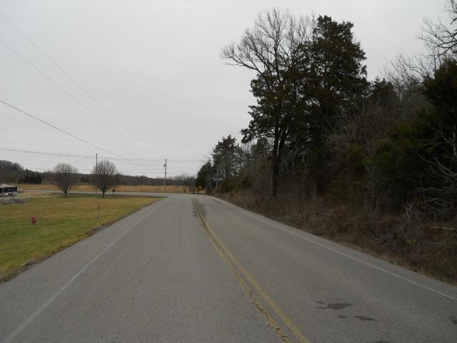 958 Rocky Valley Road Lebanon, TN 37090 - Photo 20 of 20 a view of a lake with a yard and a large window