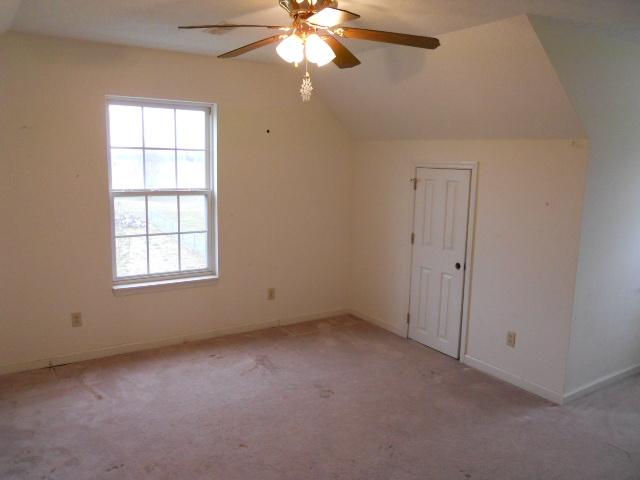 958 Rocky Valley Road Lebanon, TN 37090 - Photo 9 of 20 an empty room with windows and fan
