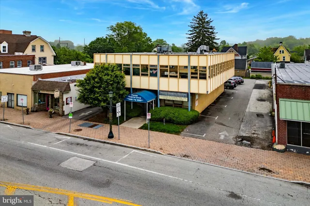 a view of a street with sitting area