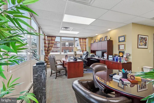 a room with furniture and a large window