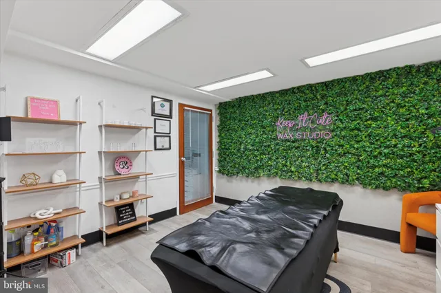 a view of a workspace with furniture