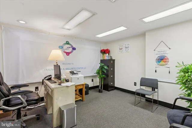 a view of a workspace with furniture