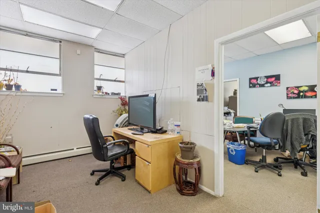 a bathroom with a sink mirror and toilet