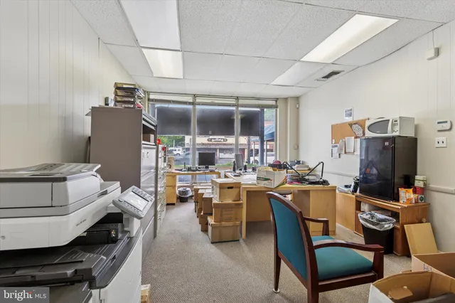 a view of a workspace with furniture and a workspace