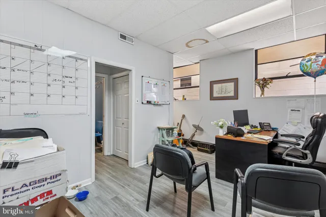 a work room with furniture and a window