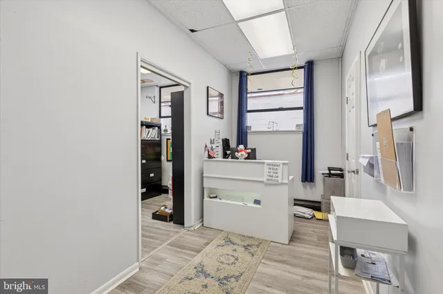 a view of car parked on the side of a street